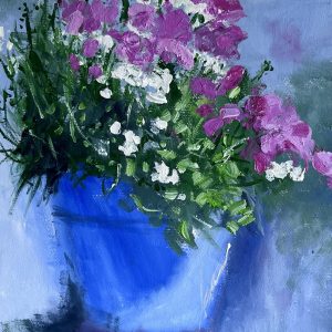 A pot of flowers taking in the sunshine